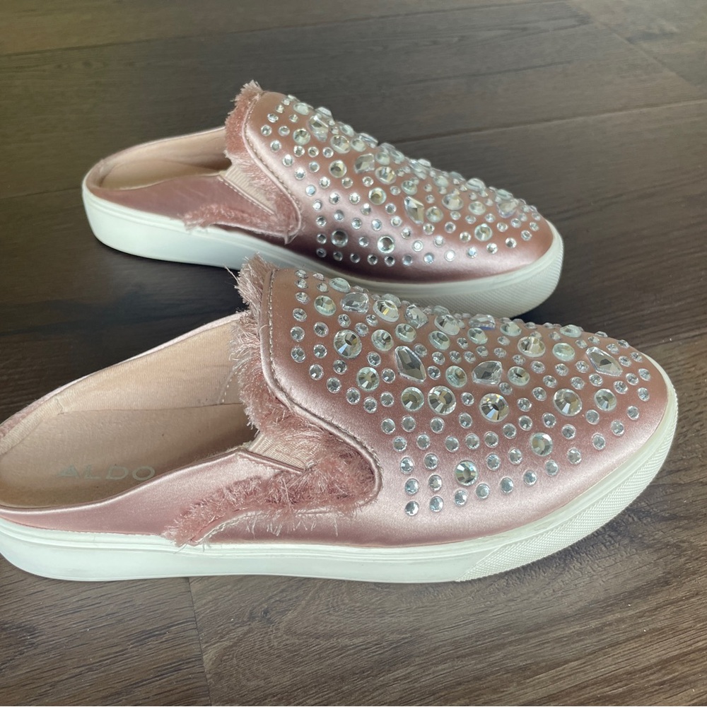 ALDO. SIZE 7.5.  Bejeweled rose pink slip-on sneakers with fringe detail